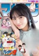 A magazine with a picture of a young woman on the cover.